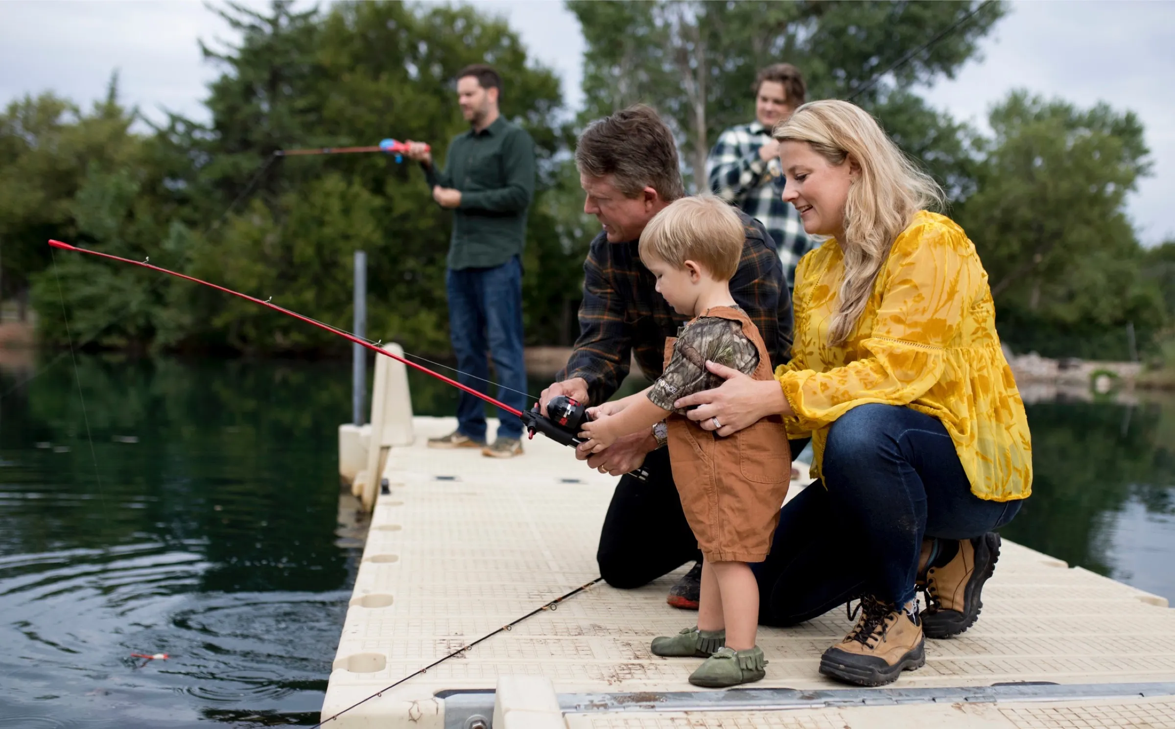 Doc fishing on the dock with his daughter and one of his grandsons.