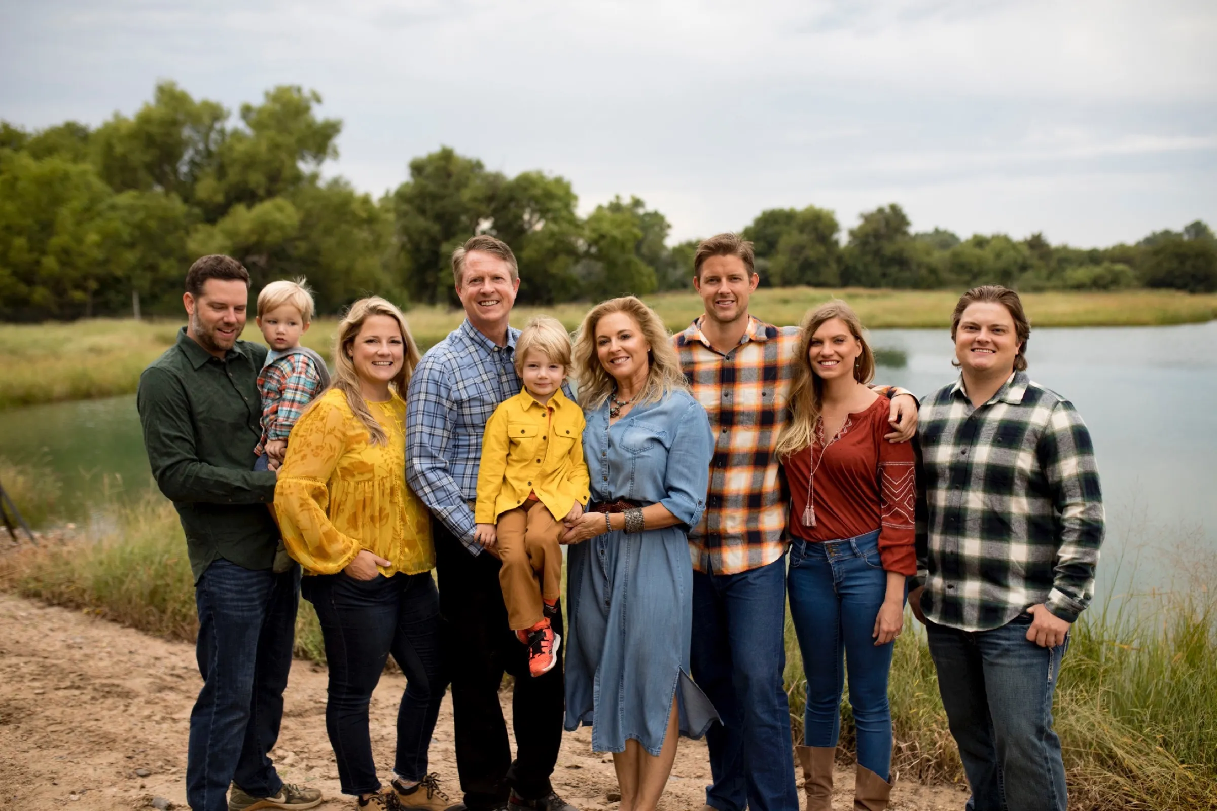 The Marshall family. Roger and Laina with their four kids, their kids' spouses, and the grandkids, at the family pond outside Great Bend.